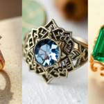 Three exquisite Fernando Jorge fashion rings featuring ruby, sapphire, and emerald gemstones with intricate gold designs, showcasing luxury and innovation.